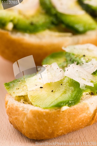 Image of Sandwich with avocado on a wooden board 
