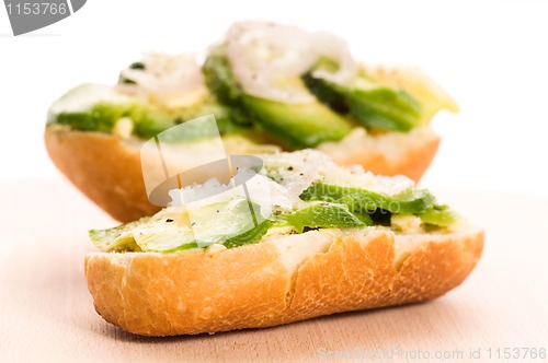 Image of Sandwich with avocado on a wooden board 