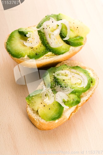 Image of Sandwich with avocado on a wooden board 