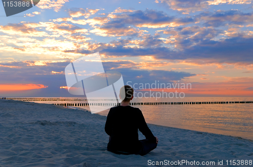 Image of meditation sunset