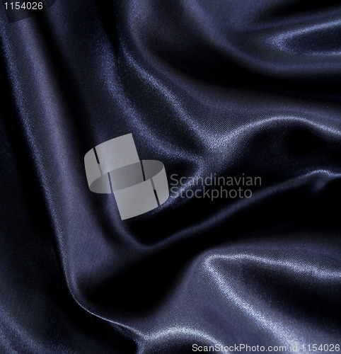 Image of Smooth elegant black silk as background 