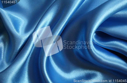 Image of Smooth elegant blue silk as background