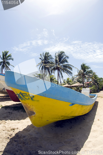 Image of fishing boat with coconut trees Waula Point Corn Island Nicaragu