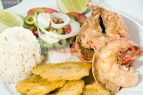 Image of Caribbean lobster tail dinner with tostones rice salad