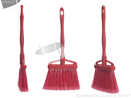 Image of Three plastic red brooms