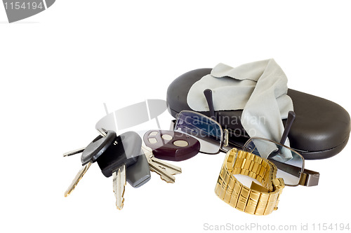 Image of Keys, glasses and a watch