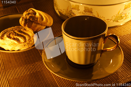 Image of a cup of tea with zephyr on candle light