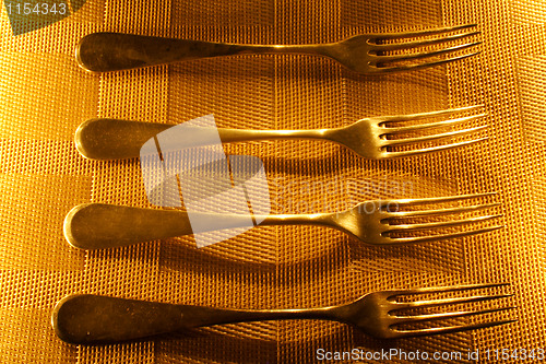 Image of four vintage silver forks