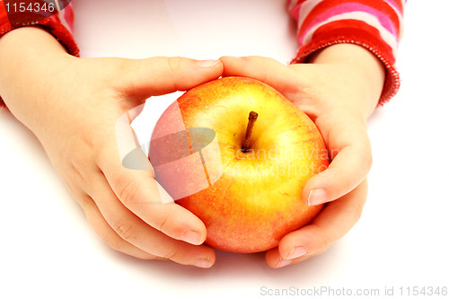 Image of child is holding fresh apple