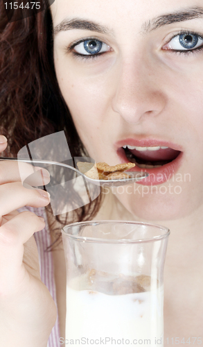 Image of Young people eating milk with cereals