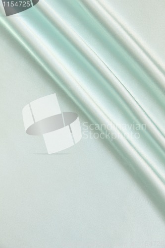 Image of Smooth elegant blue silk as background 