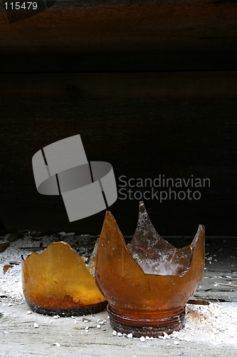 Image of broken bottle on shelf