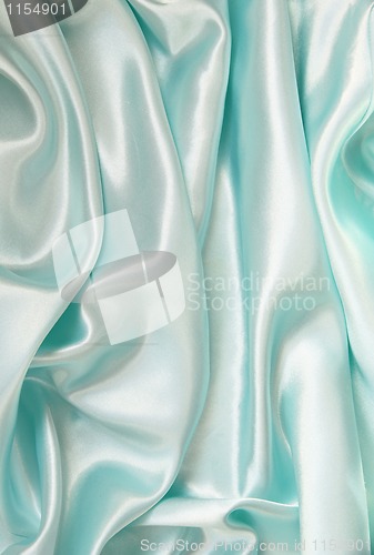 Image of Smooth elegant blue silk as background 