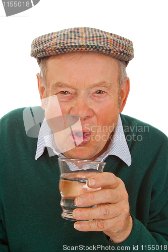Image of Male senior drinking water 