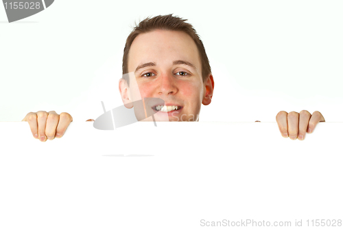 Image of Young businessman with white board