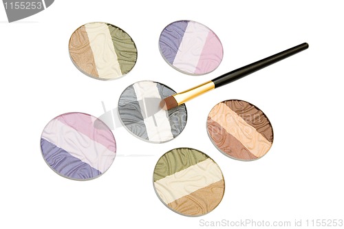 Image of makeup brush and cosmetics