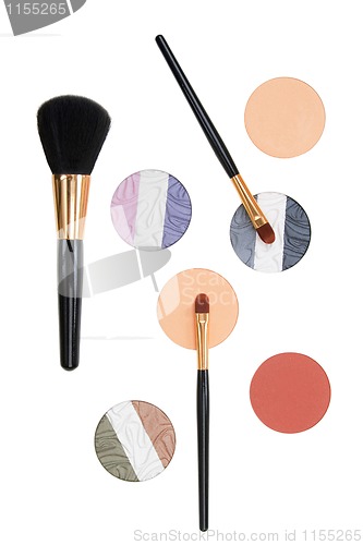 Image of makeup brush and cosmetics