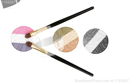 Image of makeup brush and cosmetics