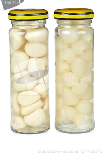 Image of Glass jars with marinated garlic and onions