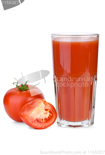Image of Drinking glass filled with tomato juice and tomatoes near