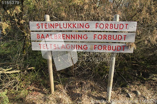 Image of Forbidden sign in the forrest.