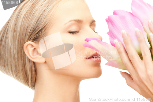 Image of beautiful woman with lotus flower