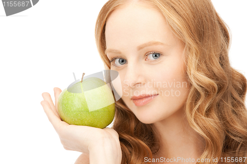 Image of young beautiful woman with green apple