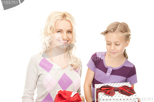 Image of mother and little girl with gifts