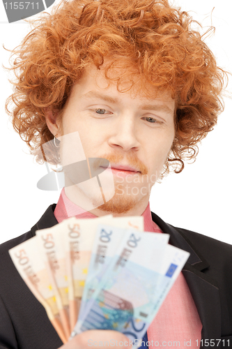 Image of handsome man with euro cash money