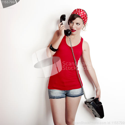 Image of Girl with a vintage phone