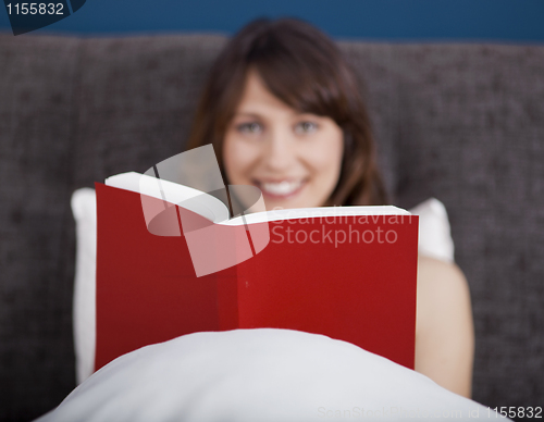 Image of Young girl reading a book