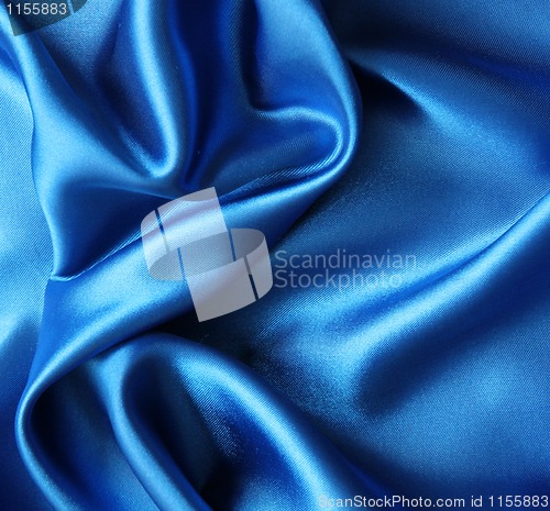 Image of Smooth elegant blue silk as background 