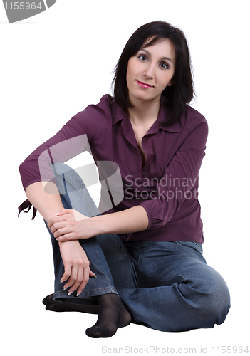 Image of Sitting girl in a purple blouse, isolated