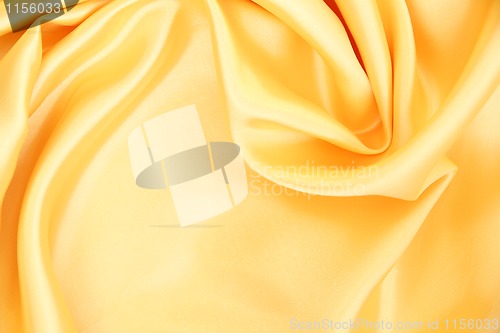 Image of Smooth elegant golden silk as background 