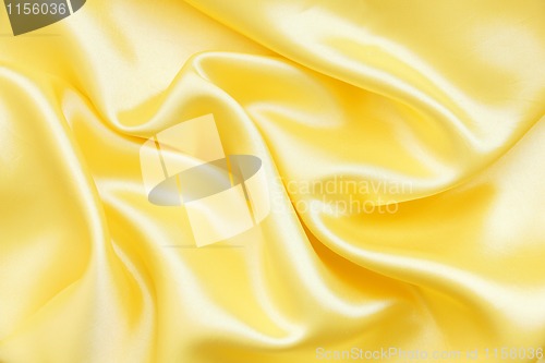 Image of Smooth elegant golden silk as background 