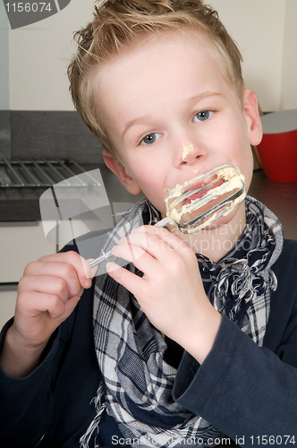 Image of Boy Eating Dough From A Beater