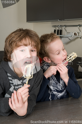 Image of Boys Eating Dough From A Beater