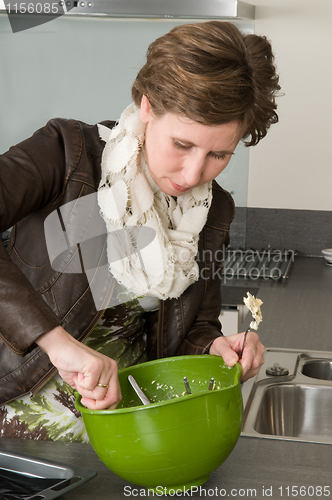 Image of Woman Baking Cakes