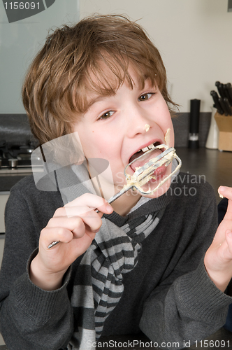 Image of Boy Eating Dough From A Beater