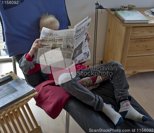 Image of Teen reading newspaper