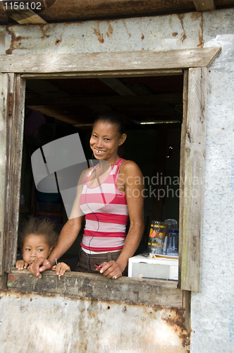 Image of Nicaragua mother daughter  smiling poverty house Corn Island
