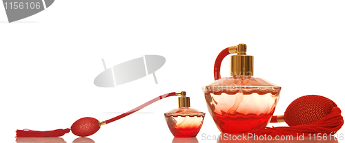 Image of Perfume in a red glass bottles