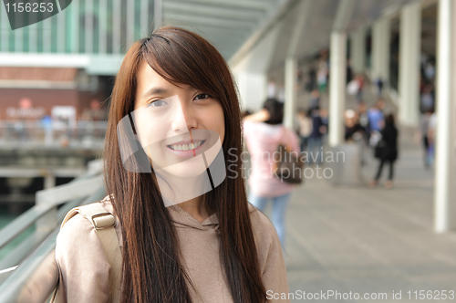 Image of woman in casual wear in city