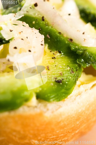 Image of Sandwich with avocado on a wooden board 