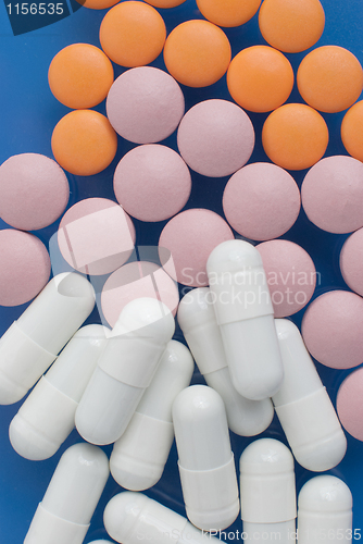 Image of White, pink and orange pills