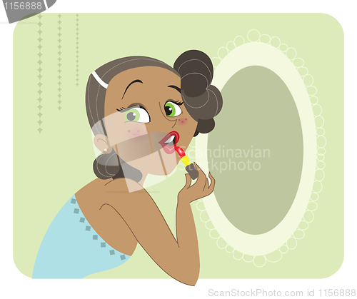 Image of Cute dark skinned brunette woman applying lipstick