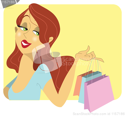 Image of Cute redhead woman with shopping bags