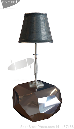 Image of Lamp with lampshade sitting on a metallic pedestal