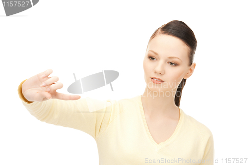 Image of businesswoman working with something imaginary