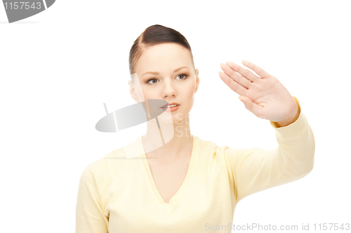 Image of businesswoman working with something imaginary
